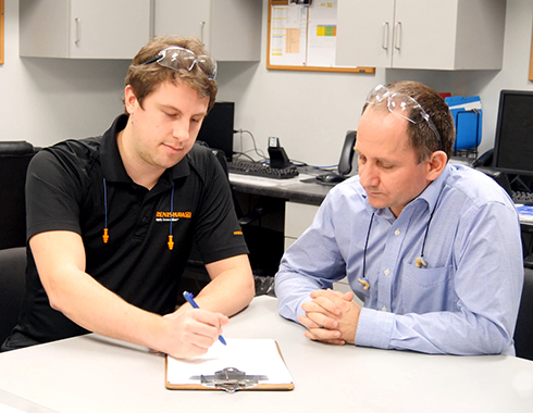 Narcis Georgescu, Senior Quality Supervisor at Linex (right) consults with Renishaw applications engineer